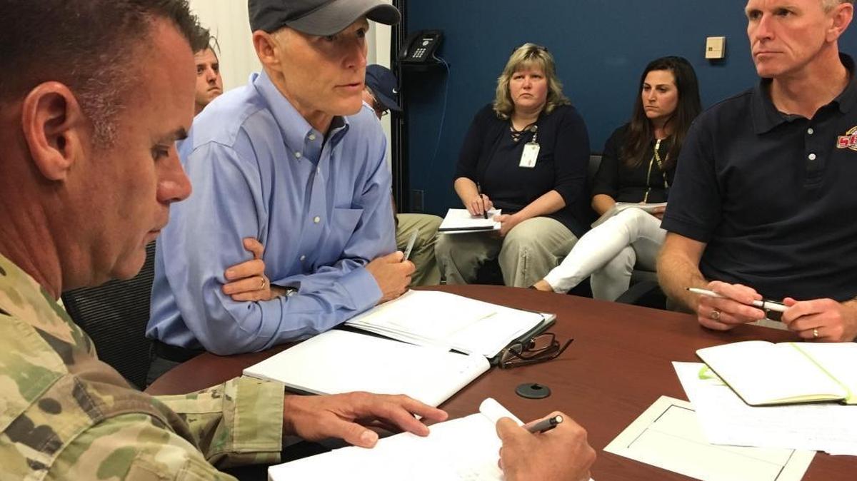 Florida Gov. Rick Scott, center, hears about the latest preparations for Hurricane Irma from Florida emergency management director Bryan Koon, right, and other officials during a 5 p.m. briefing at the state Emergency Operations Center in Tallahassee on Sept. 5, 2017.