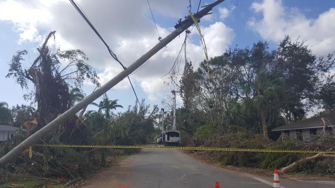 Repair crews worked to right a leaning electrical pole at SW 115th Street and 74th Avenue on Saturday morning.