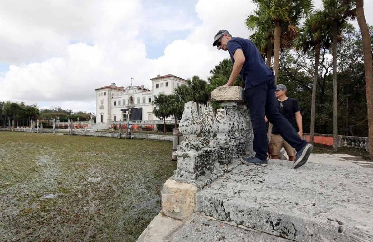Joel Hoffman, executive director of Vizcaya Museum and Gardens, assesses the damage done to a railing on the sea arm landing. Vizcaya suffered some flooding and wind damage due to Hurricane Irma on Sunday.