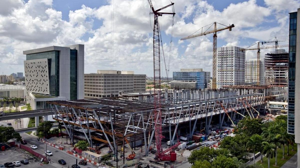 Three giant cranes tower over the MiamiCentral Brightline train station in downtown Miami on August 7, 2017. The cranes are designed to spin in the wind like weather vanes, so they don’t need to come down if Hurricane Irma strikes South Florida.
