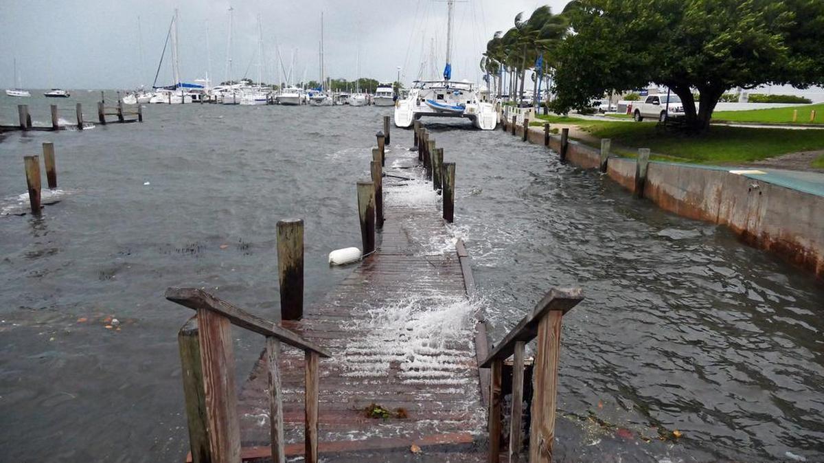 Docks at Grove Harbour Marina get battered by winds and surf as high tide begins to roll in and strong winds from Hurricane Irma began on Saturday morning, Sept. 9, 2017.
