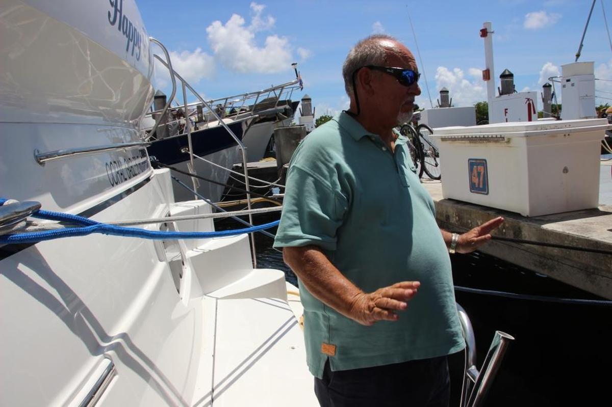 Luis M. Gonzalez stands on his yacht, secured with more ropes than usual ahead of Hurricane Irma on Thursday.