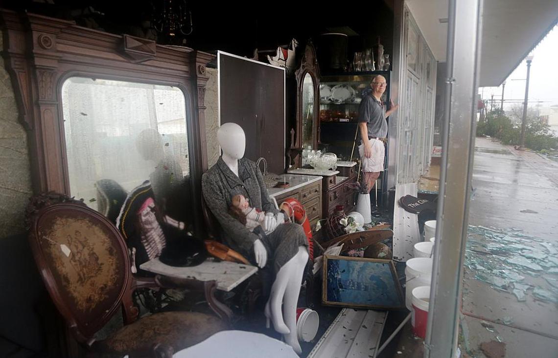 Mike Lindsey, owner of the Elegant Endeavors Antique Emporium, checks damage to his family store in Panama City after Hurricane Michael slammed the Panhandle with 155 mph winds Wednesday.