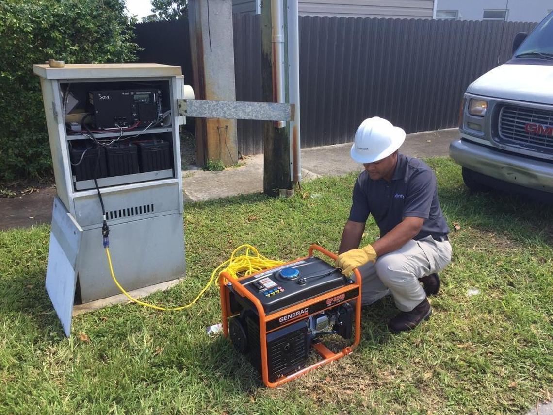 On Monday in Hialeah, a Comcast tech works on a piece of equipment that needs to be powered by generator because Comcast said it had no no commercial power to its equipment in that area.