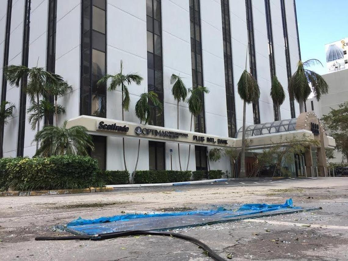 A mostly intact window lies in the parking lot of 1000 Brickell Ave, ten stories below the Ocean Bank building it came from.
