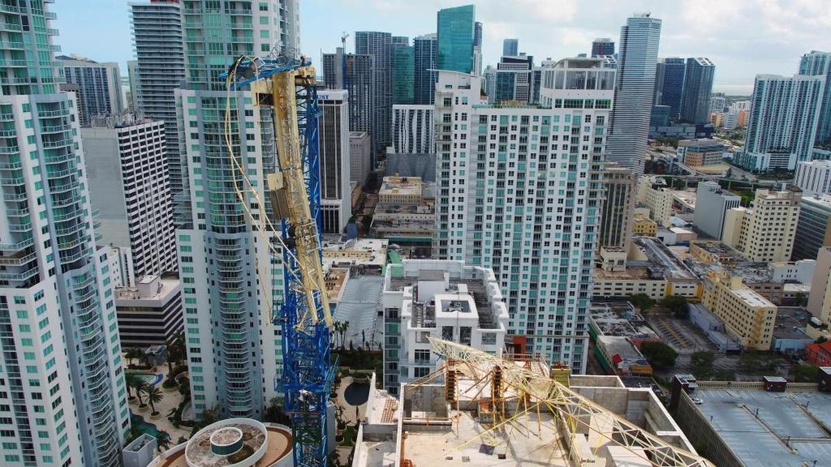 Condo development is booming in Miami. Hurricane Irma damaged this crane in a bay-front area filled with hotels and high-rise condo and office buildings near the AmericanAirlines Arena, where the NBA’s Miami Heat plays.