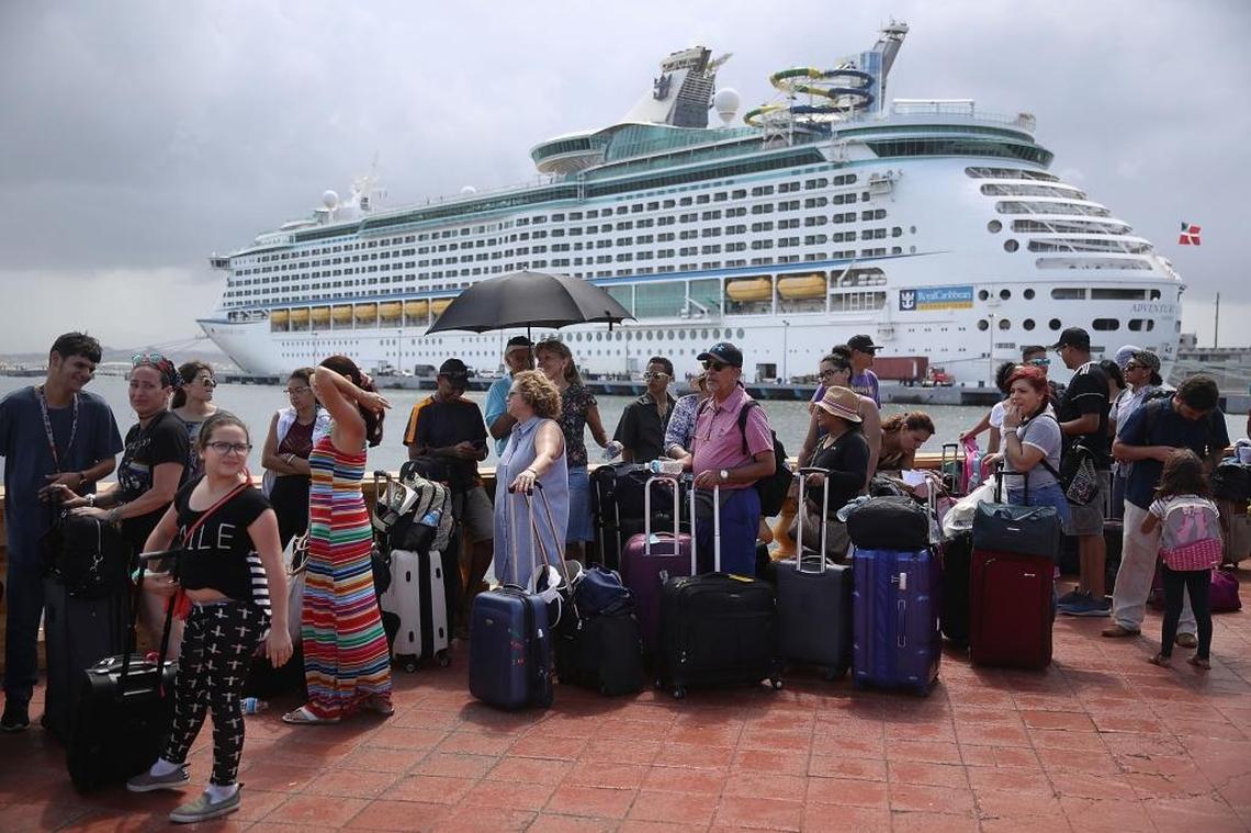 People line up to get on a Royal Caribbean International’s Adventure of the Seas, a relief boat that is sailing to Fort Lauderdale, Florida with evacuees that are fleeing after the island was hit by Hurricane Maria on Sept. 28 in San Juan, Puerto Rico. Puerto Rico experienced widespread damage including to most of the electrical, gas and water grid as well as agriculture after Hurricane Maria, a Category 4 hurricane, passed through.