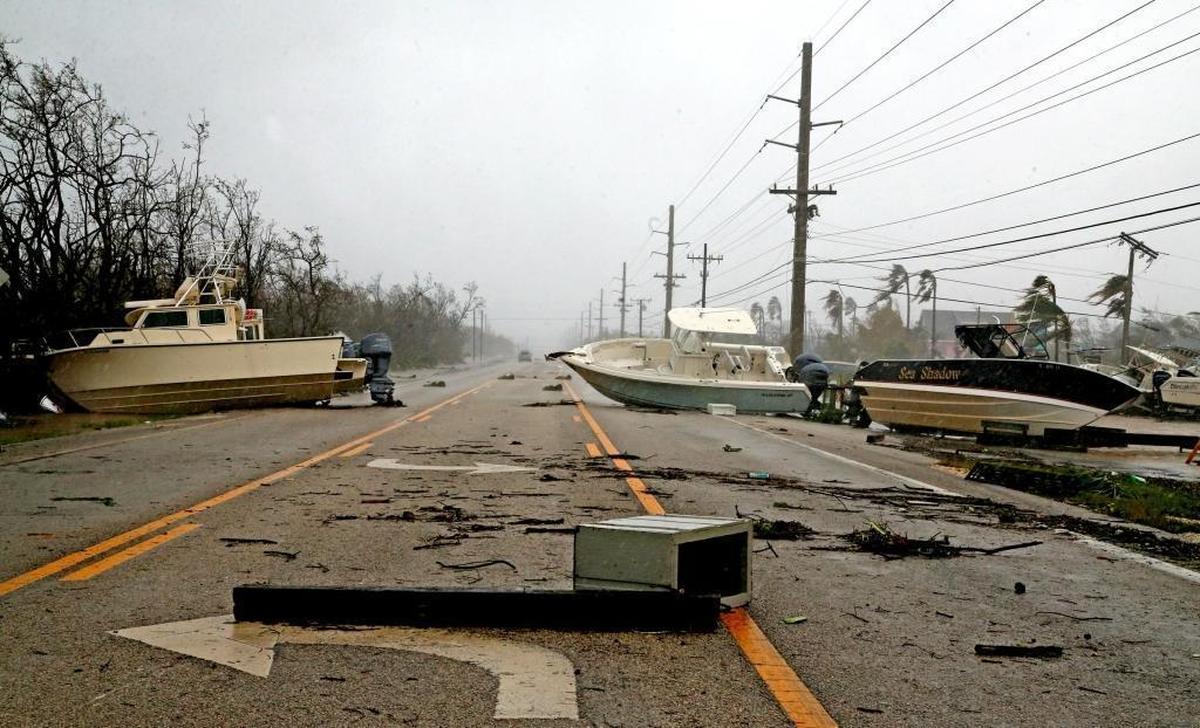 Boats block the Overseas Highway after a Hurricane Irma surge tossed boats, cars, sheds and appliances onto the highway throughout the Middle Keys, September 10, 2017.