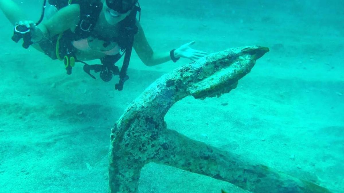 A diver with Rainbow Reef Dive Center inspects an anchor uncovered when Hurricane Irma shifted sands near the ‘Benwood’ shipwreck off Key Largo.