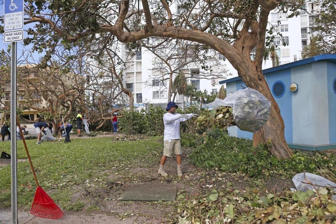 Kristo Kotorri of Miami Beach Parks and Recreation removes debris at Allison Park.