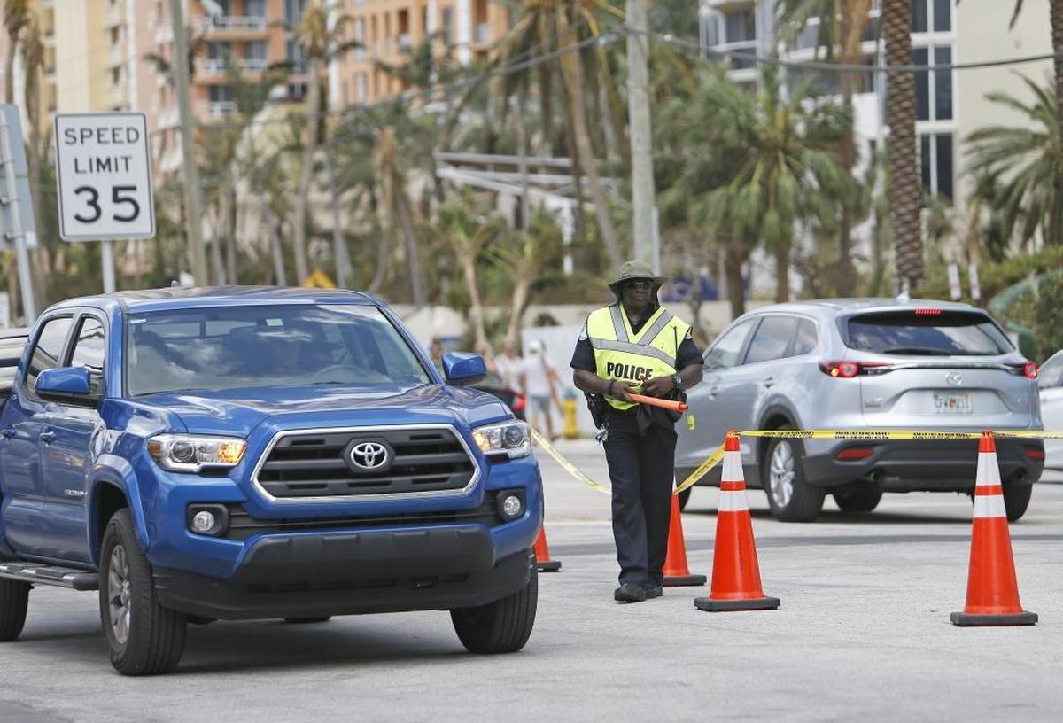 Sunny Isles Beach police directing traffic on Collins Avenue Tuesday as residents who evacuated for Hurricane Irma return to the city.