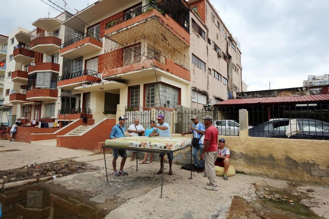 Workers from Reparador de Colchones A Domicilio, travel through Havana neighborhoods damaged by the outer bands of Hurricane Irma, stuffing and repairing mattresses damaged by the storm.