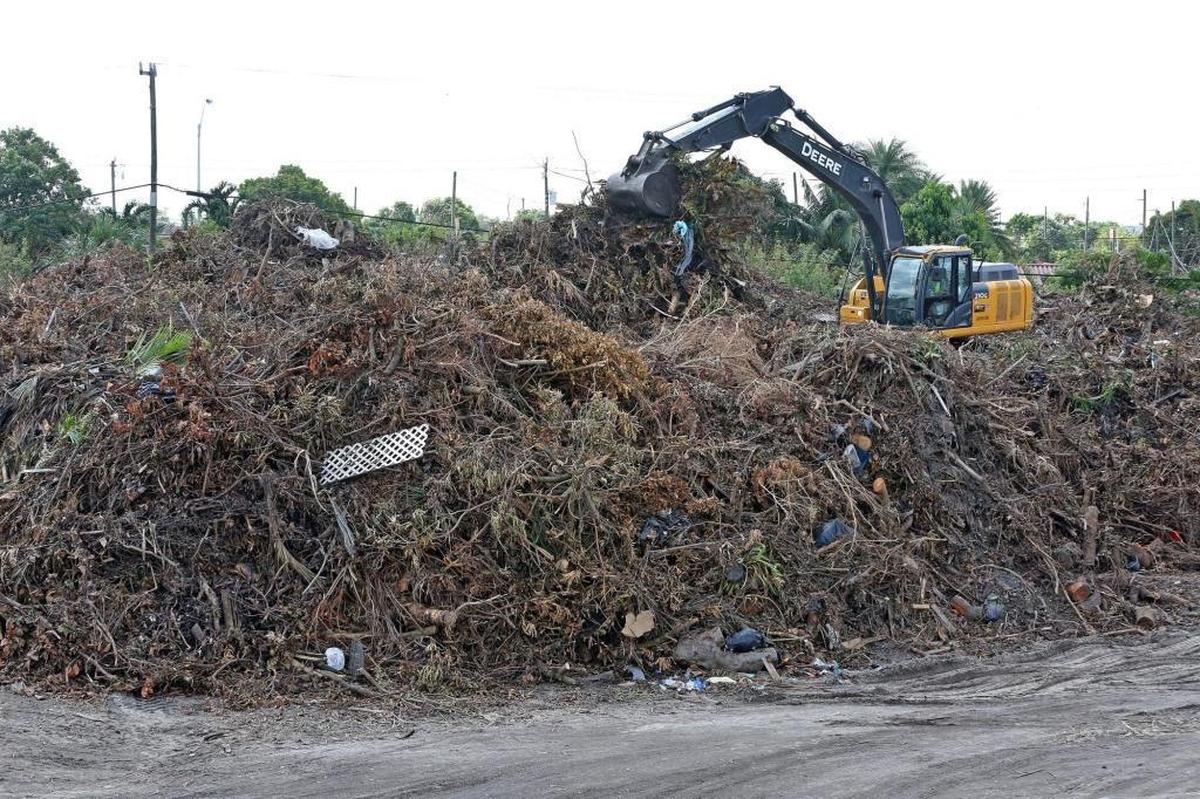 Crews drop off debris from Hurricane Irma at a FEMA staging site in Hialeah in the 5600 block of East Eighth Avenue, behind the police station, on Thursday, September 28, 2017.