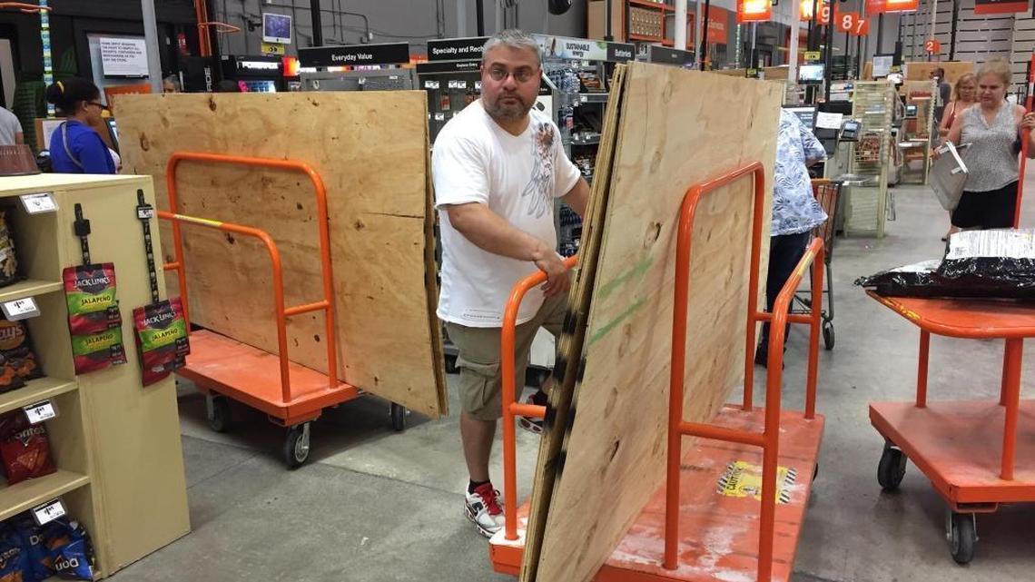John Pepper of Miami buying plywood to cover his french doors in preparation for Hurricane Irma at Home Depot on SW 8th Street.