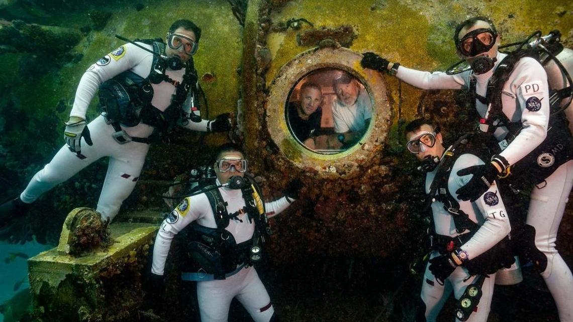 Aquanauts gather outside the Florida International University’s Aquarius underwater lab off Key Largo in this undated photo.