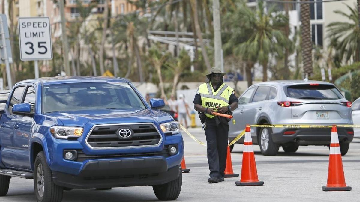 Sunny Isles Beach police direct traffic at 17534 Collins Ave. in the Hurricane Irma aftermath on Tuesday, September 12, 2017.