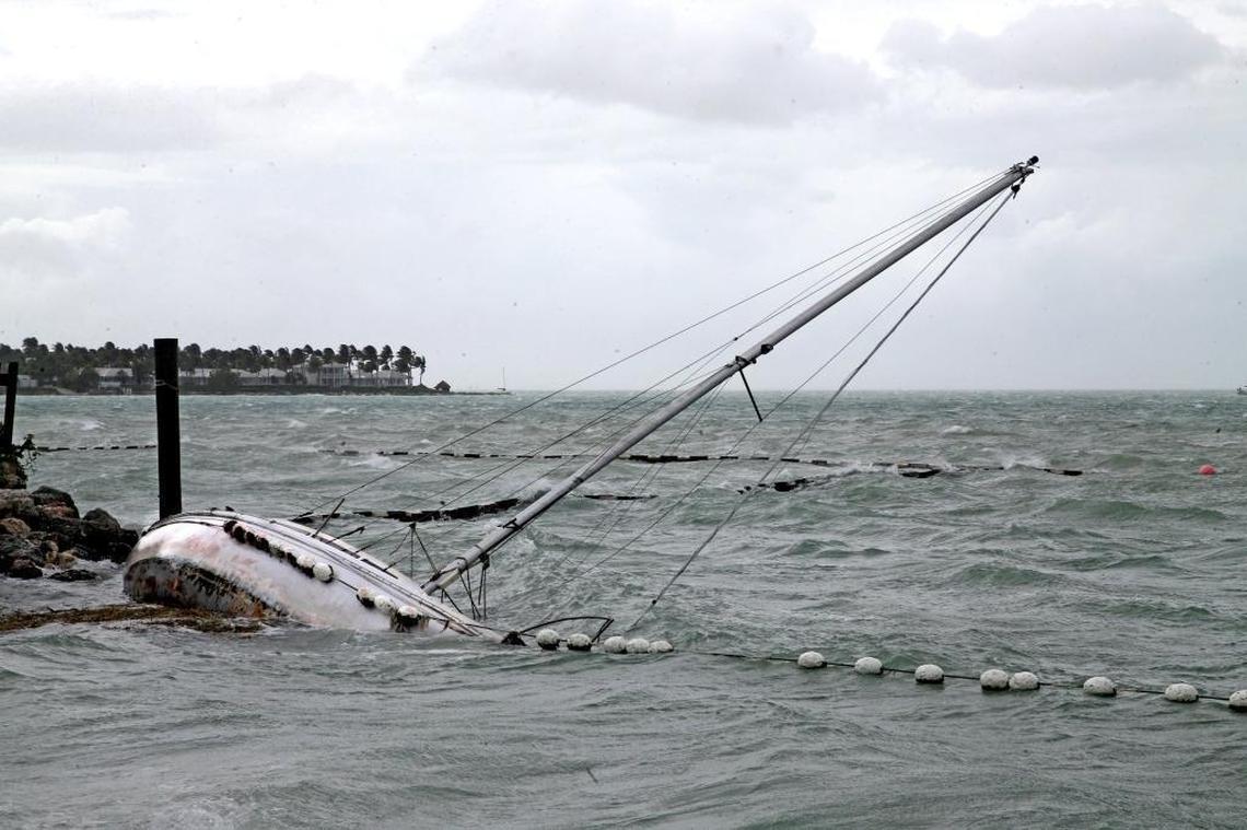A sailboat crashes on the shore near Mallory Square Saturday as Irma’s winds whipped up waves.
