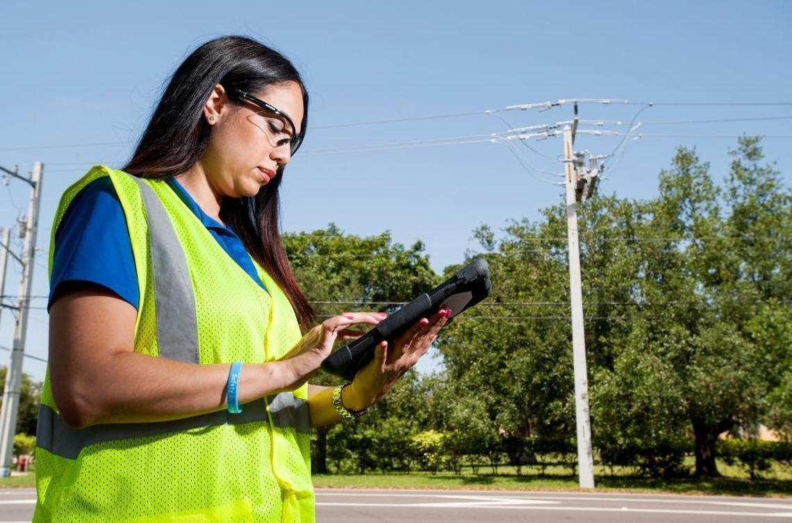 FPL engineer Cindy Gomez practices her storm role during the company’s staging site training in Pompano Beach, on May 26, 2017. Gomez is practicing patrolling areas of damage after a storm and noting any equipment damaged on her tablet, which provides information quickly and efficiently to the company so crews can be dispatched to repair the damage.