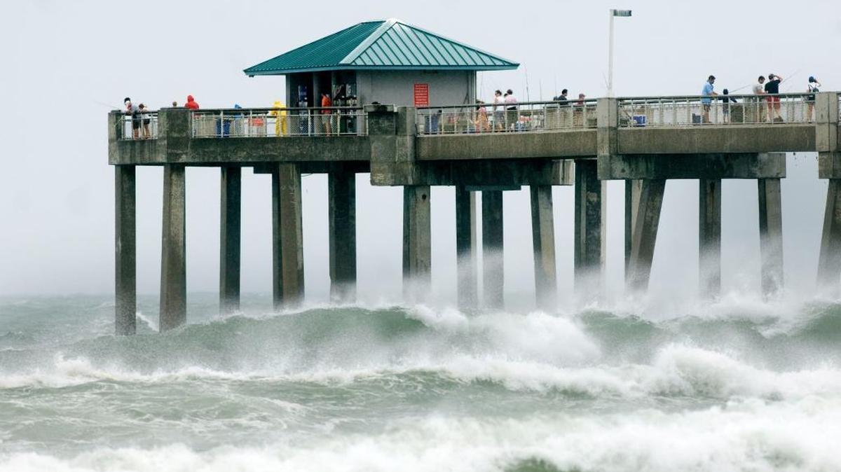 Forecasters say a system in the western Caribbean has a 60 percent chance of strengthening to a tropical cyclone over the next five days. The storm could raise the risk of flooding or beach erosion from heavy winds like winds kicked up by Tropical Storm Debby, pictured here, on Fort Walton Beach in 2012.