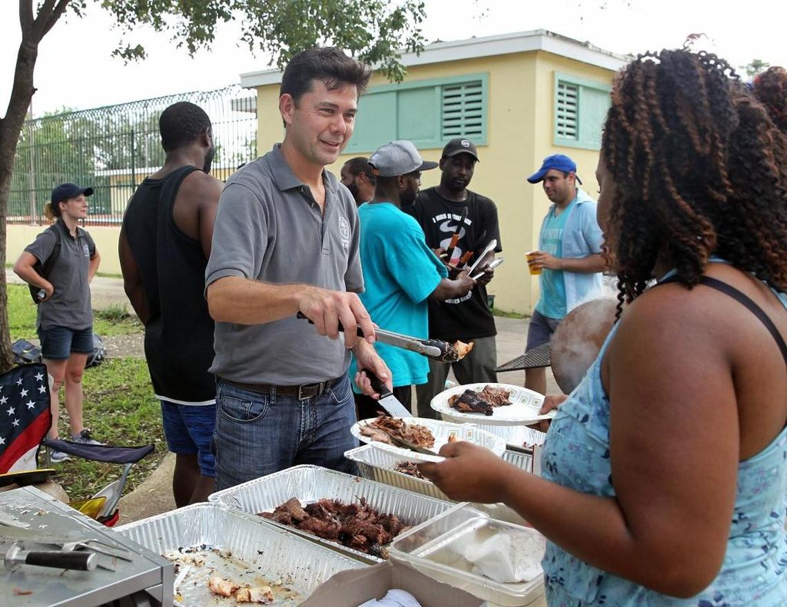 Miami commissioner Ken Russell serves the residents of Coconut Grove filet mignon, brisket, sea bass, octopus, lobster, lamb shanks, chateaubriand and much more at Elizabeth Virrick Park at a cookout with foods donated by Villa Azur restaurant in South Beach on Tuesday, Sept. 12, 2017.