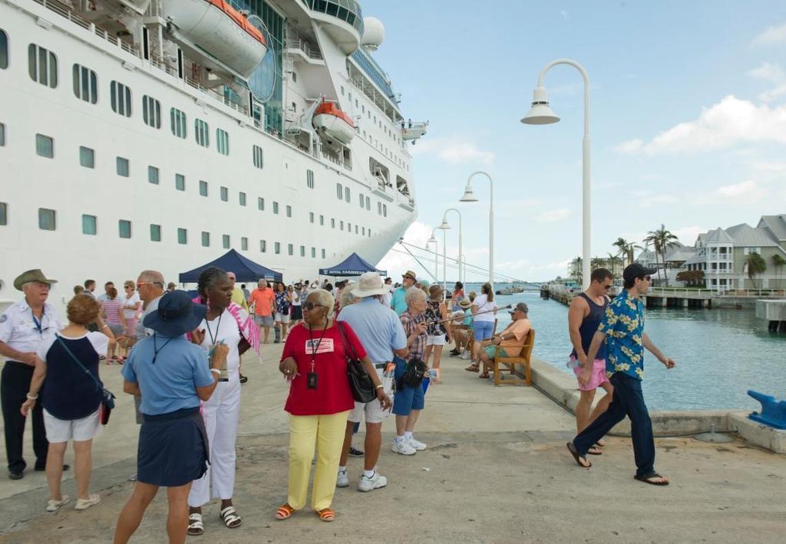In this photo provided by the Florida Keys News Bureau, passengers from the Empress of the Seas walk on the Pier B cruise ship dock after the ship arrived in Key West, Fla., Sunday, Sept. 24, 2017. The ship's port call was the first time a cruise ship has docked in Key West since prior to Hurricane Irma's passage through the Florida Keys.