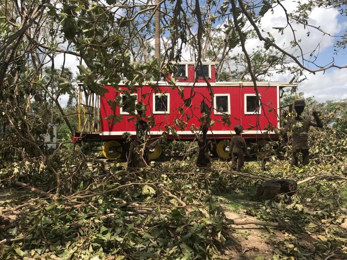 Cauley Square’s tree canopy was completely destroyed by Hurricane Irma. This is a view of the village’s remaining caboose Monday, Sept. 11, 2017.