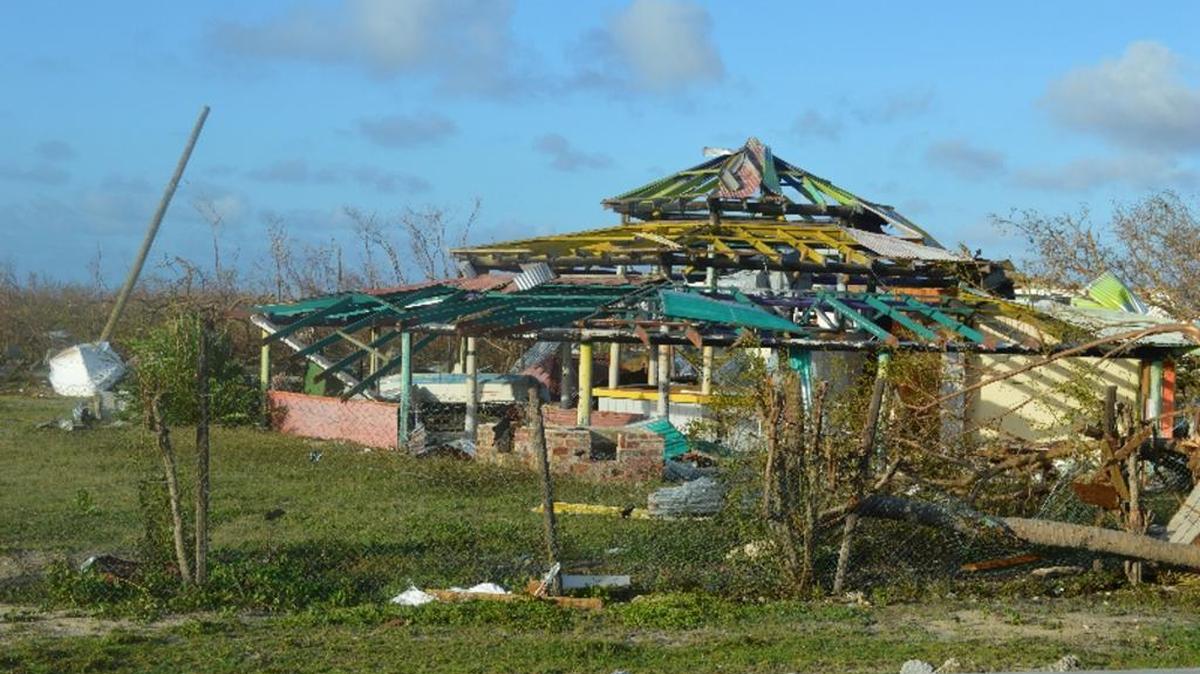 In this Thursday, Sept. 7, 2017, photo, damage is left after Hurricane Irma hit Barbuda. Hurricane Irma battered the Turks and Caicos Islands early Friday as the fearsome Category 5 storm continued a rampage through the Caribbean that has killed a number of people, with Florida in its sights.