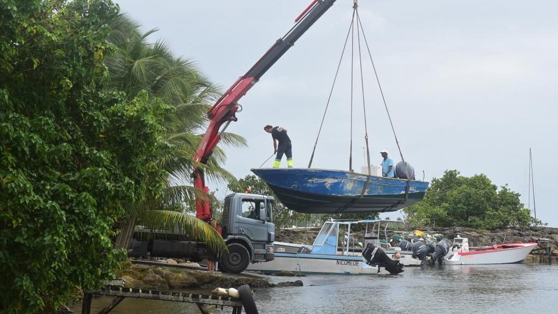 Men remove boats from the water ahead of Hurricane Maria in the Galbas area of Sainte-Anne on the French Caribbean island of Guadeloupe.