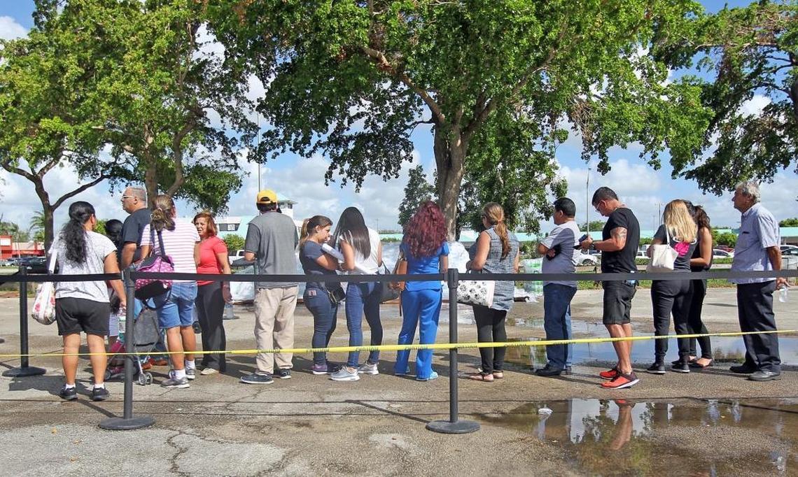 People line up to apply for assistance at Tropical Park where the Department of Children and Families and the U.S Department of Agriculture are coordinating the Food for Florida Disaster Assistance Program on Wednesday, October 11, 2017