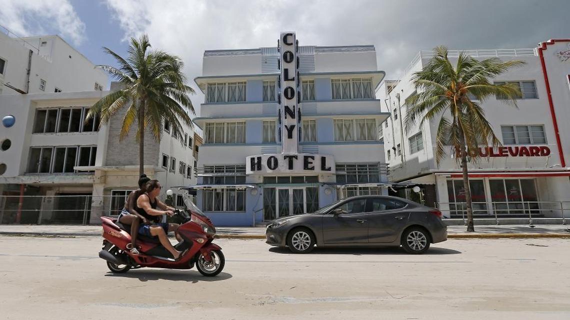 Vehicular traffic on a street full of sand in front of The Colony Hotel after the passage of Hurricane Irma on Monday, September 11, 2017 in Miami Beach.