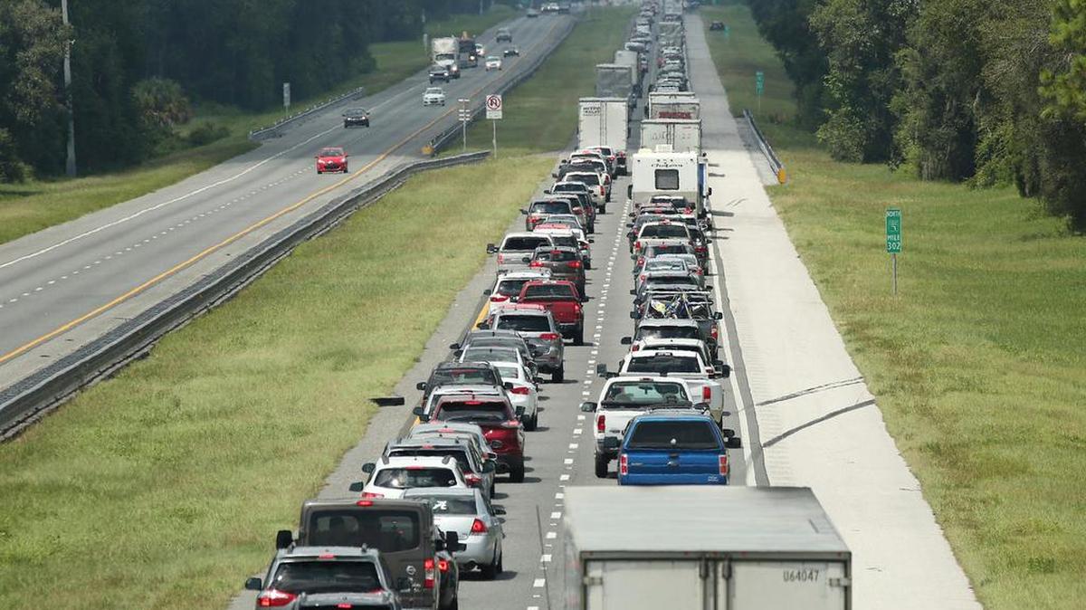 Traffic rolls at a crawl on the northbound lanes of Florida's Turnpike near the intersection of I-75 in Wildwood, Friday, Sept. 8, 2017. Motorists are evacuating for the anticipated arrival of Hurricane Irma.