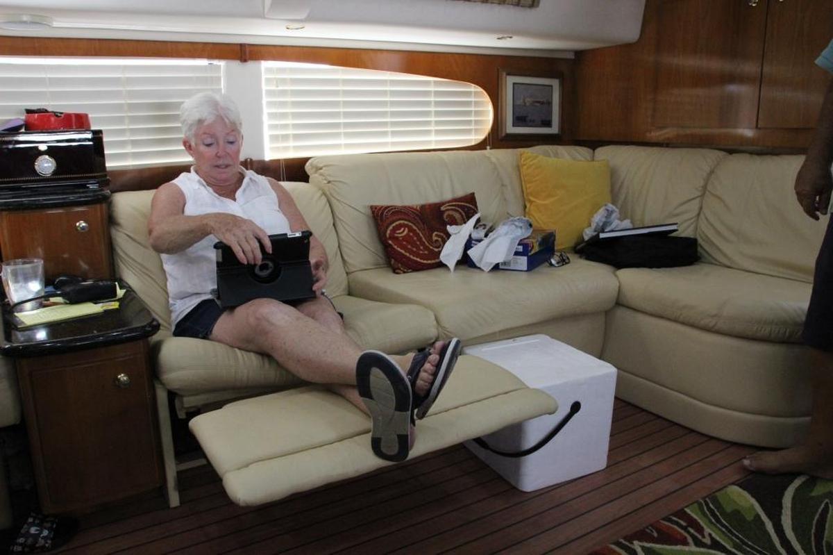 Gini Gonzalez sits in her favorite spot on the yacht where she lives with her husband. She spends her free time reading in this seat, but with Hurricane Irma approaching, she fears they will lose this boat.