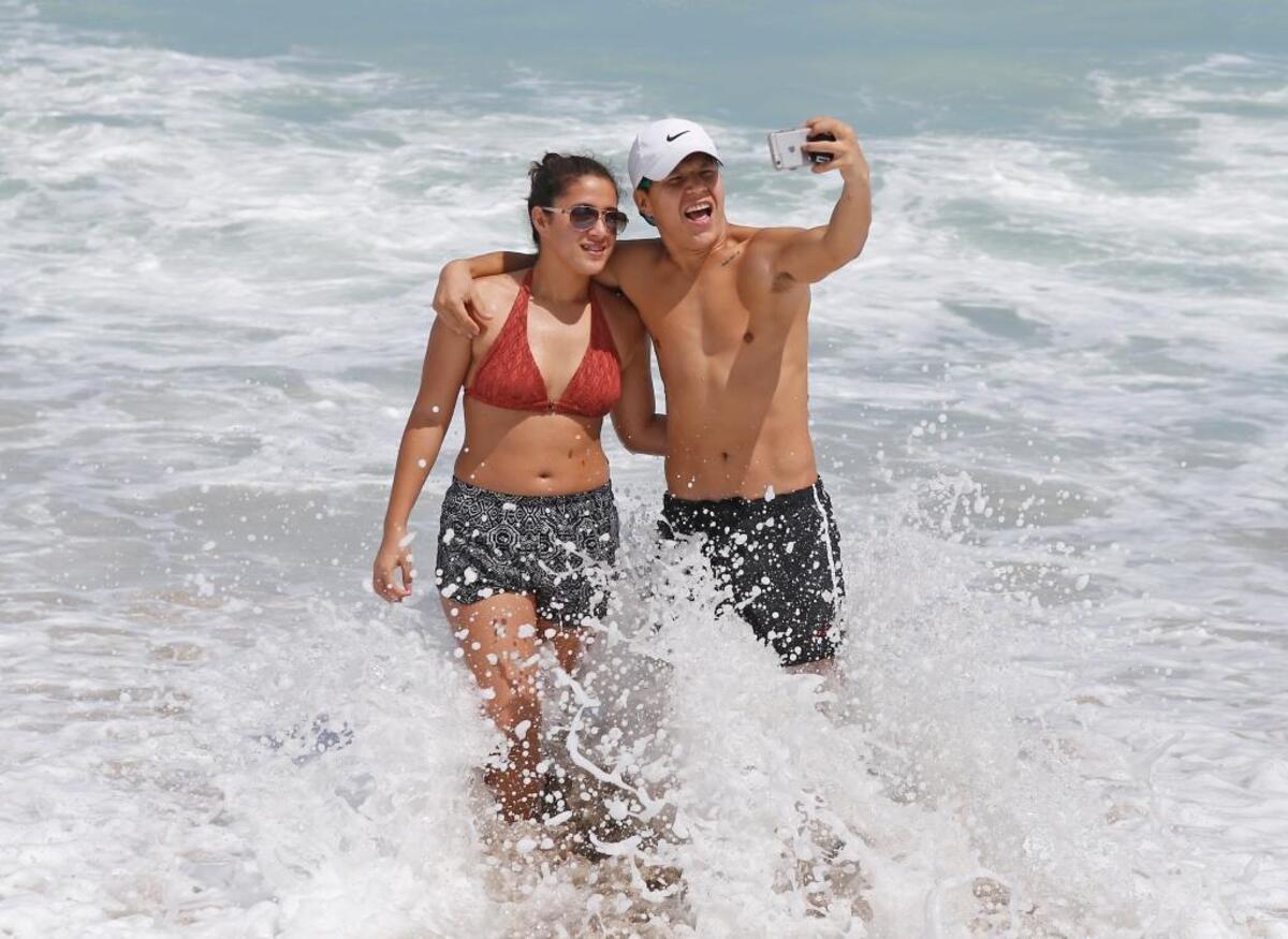 Beck Jumaev and Selina Garciatake take selfies at Haulover Beach in the Hurricane Irma aftermath on Tuesday, September 12, 2017 in Miami Beach.