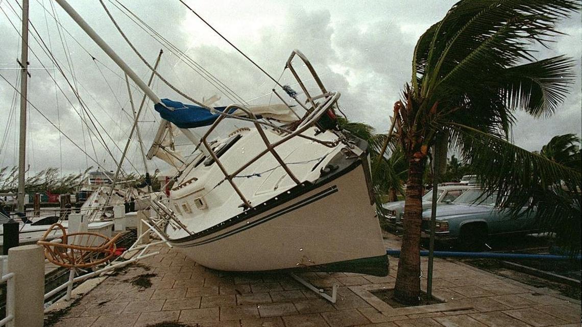 A sailboat sits on a sidewalk at Dinner Key after it was washed ashore by Hurricane Andrew, August 24, 1992.