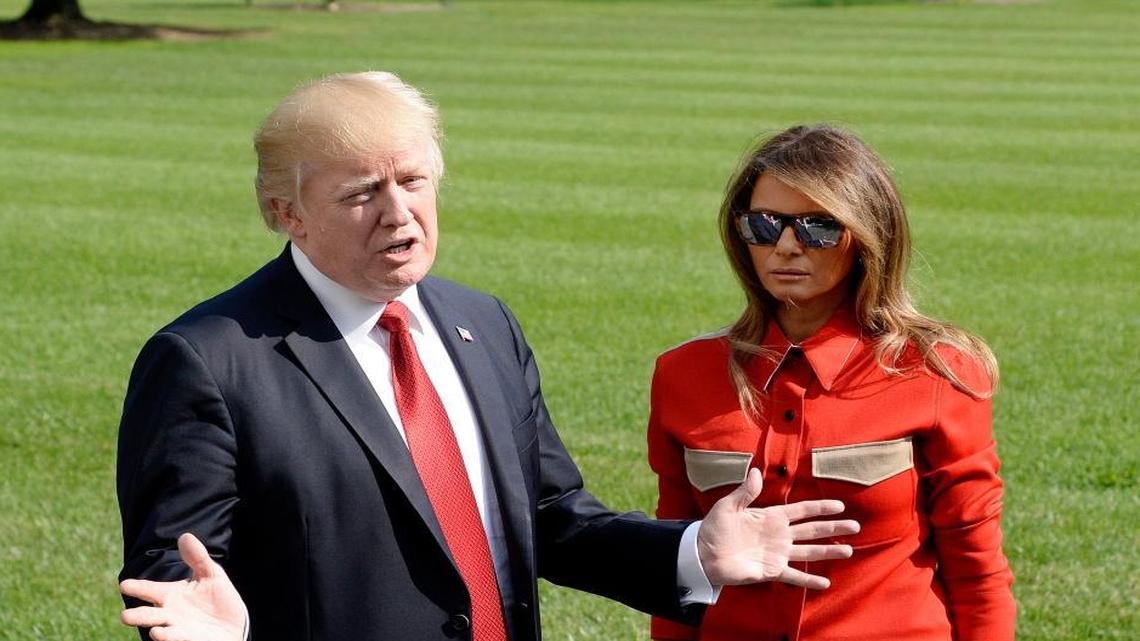 President Donald Trump speaks to members of the media about Hurricane Irma as first lady Melania Trump looks on upon arrival on the South Lawn of the White House on Sunday, Sept. 10, 2017 in Washington, D.C., after spending the weekend at Camp David, the presidential retreat in Maryland.