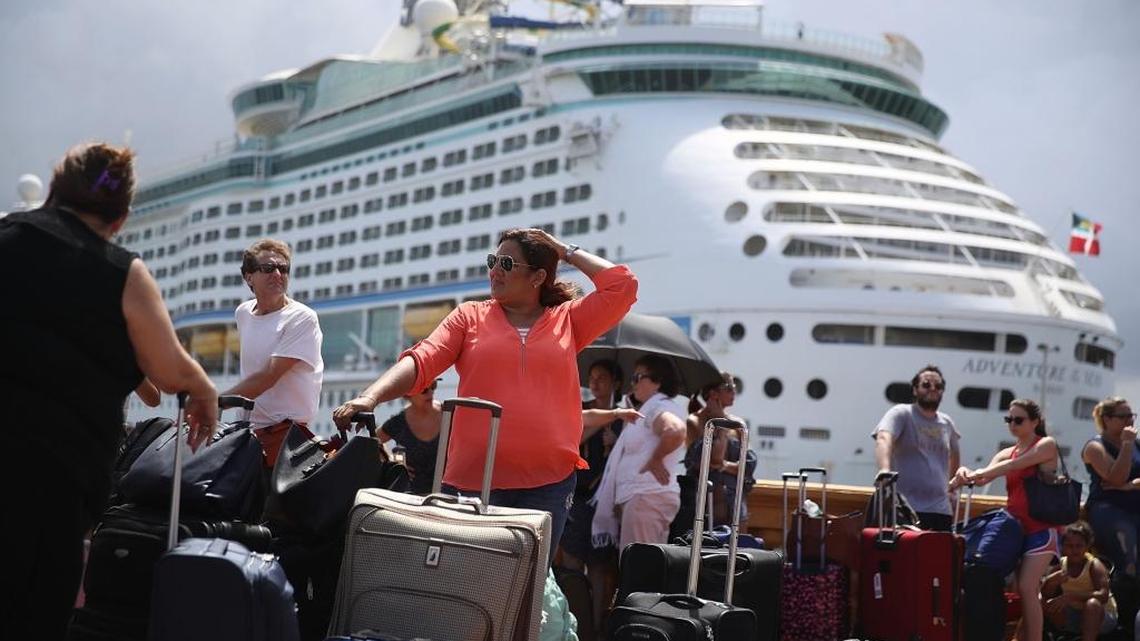 People line up to get on a Royal Caribbean International’s Adventure of the Seas, a relief boat that is sailing to Fort Lauderdale, Florida with evacuees that are fleeing after the island was hit by Hurricane Maria on Sept. 28 in San Juan, Puerto Rico. Puerto Rico experienced widespread damage including to most of the electrical, gas and water grid as well as agriculture after Hurricane Maria, a Category 4 hurricane, passed through.