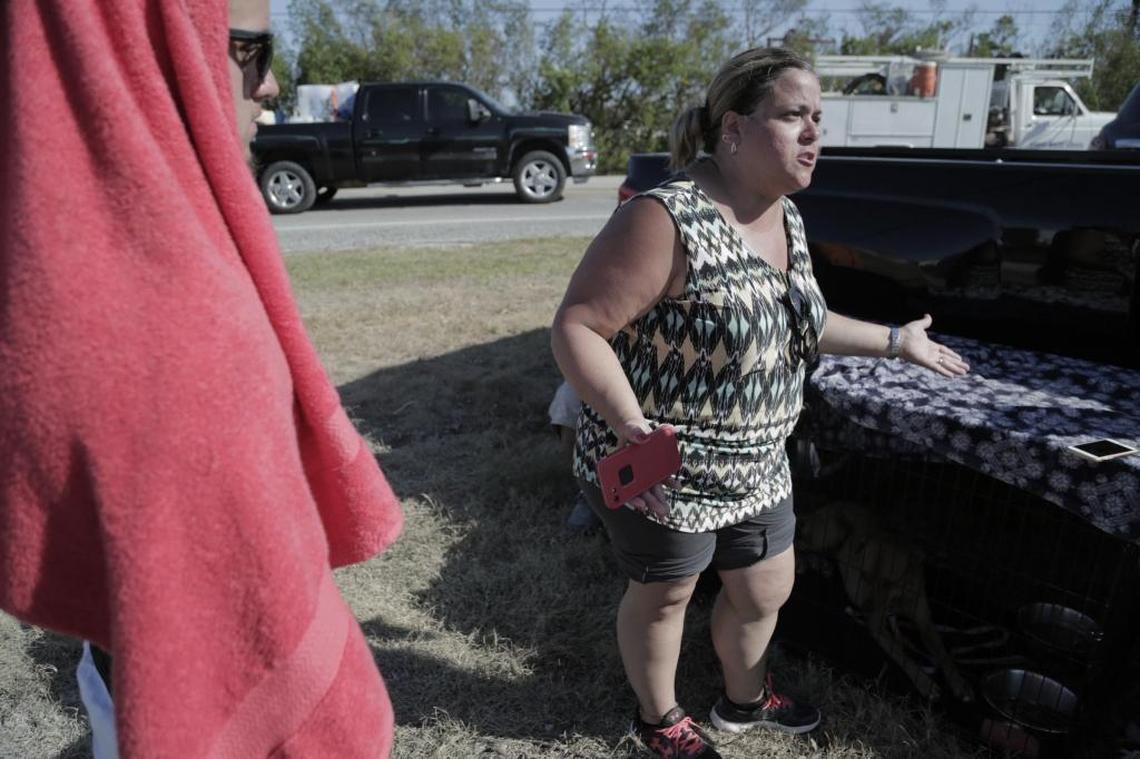 Judith Silva (right) and her son Danny Valladares (left) wait on the side of the road at mile Marker 74 on Sept. 14, with the hopes that authorities would let them back in to Marathon Key so they can start assessing damages to their home and business. So far, authorities have refused resident access to their homes after Hurricane Irma made landfall in the keys on September 10 causing widespread damage to the area.