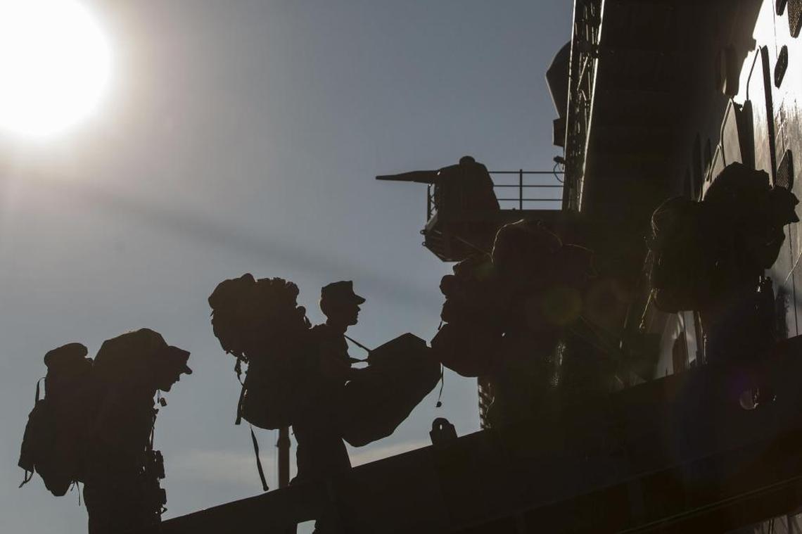 Marines board the USS Kearsarge at Naval Station Norfolk, Va., on Aug. 30, 2017, to join Hurricane Harvey relief efforts in this Pentagon handout photo. The troops and warship have since been put on standby for Irma relief efforts.