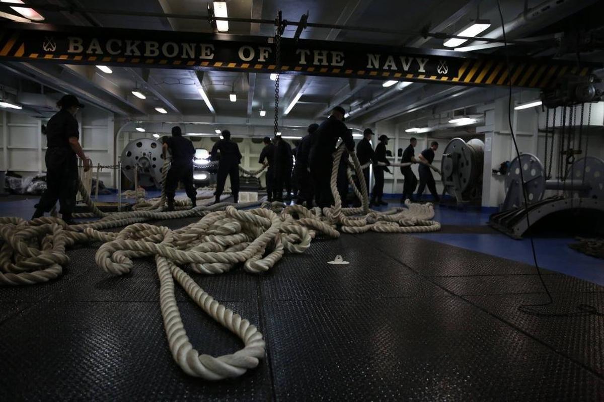 Sailors aboard the Nimitz-class aircraft carrier USS Abraham Lincoln, getting underway out of Norfolk, Virginia, on Sept. 9, 2017 to be in position to provide humanitarian relief to victims of Hurricane Irma in this Navy handout photo.
