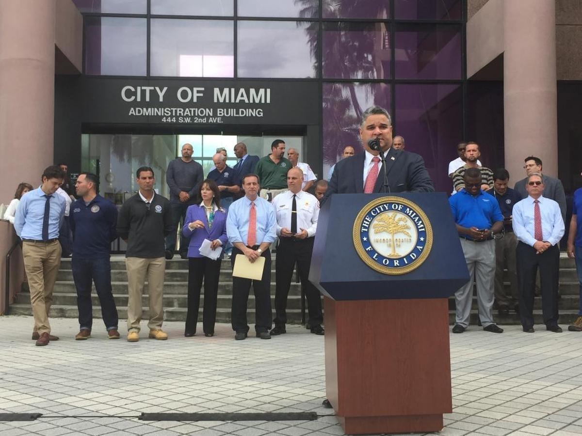City Manager Daniel Alfonso stands in front of the Miami Riverside Center in downtown Miami to discuss the city’s preparations for Hurricane Irma.