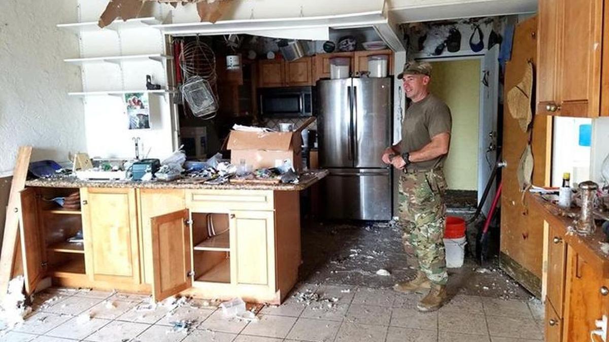 Quincy, Fla.,-based Florida National Guard Bravo Guard 753rd Brigade Engineering Battalion, 1st Lt. Michael Purvis. On Avenue D in Coco Plum in Marathon Saturday early afternoon. The platoon was ripping out moldy walls for those who couldn't do it themselves. Great bunch of guys and girls, two or three dozen.