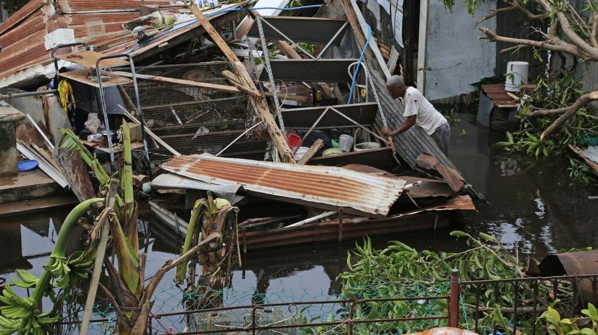 Farmer Victor Lozada searches for items that can be salvage from his shed that was completely destroyed by Hurricane Maria. Residents of the beach town of Loiza, Puerto Rico who received heavy flooding and wind damage have no power, no running water, but are working extremely hard to piece back their lives.