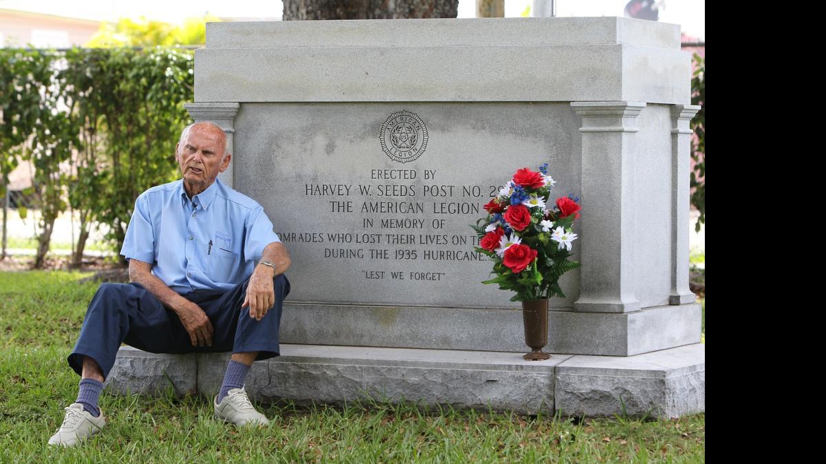 
Jerry Wilkinson sits on a granite monument at Miami’s Woodlawn Cemetery on Southwest Eighth Street where 74 U.S. soldiers are buried in unmarked graves after dying in one of the worst hurricanes to ever strike U.S. shores. Wilkinson and another vet have been fighting to have markers placed on the graves.
