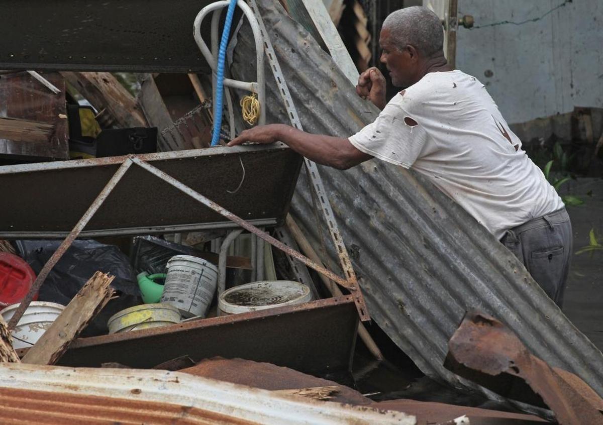 Farmer Victor Lozada searches for items that can be salvage from his shed, completely destroyed by Hurricane Maria. Residents of the beach town of Loiza, Puerto Rico, have no power and no running water in the aftermath of Hurricane Maria.