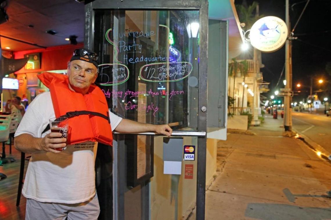 Mike Powers stands in the doorway of the Salty Angler Bar wearing a life vest on Duval Street, Friday, September 8, 2017. He is one of the residents of Key West who refused to evacuate as Hurricane Irma approaches the Florida Keys as a Catagory 5 storm.