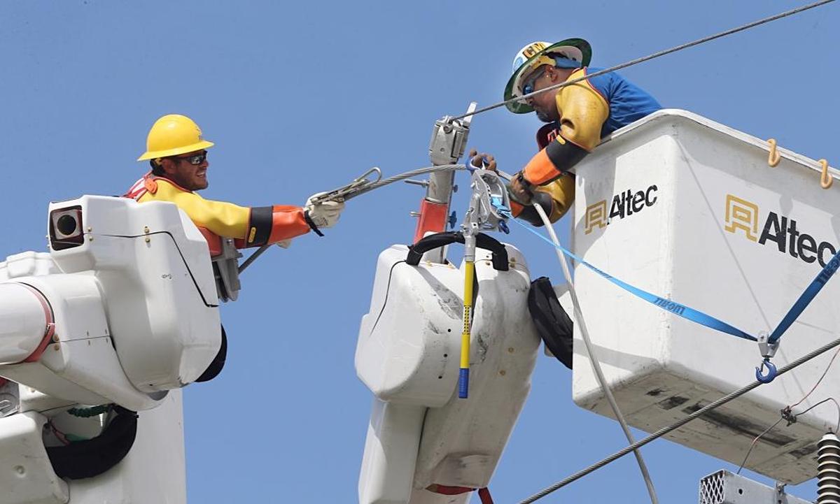 Life post-Irma won’t be back to normal for most people until their power is restored. These linemen were reconnecting a main power line in Kendall on Monday.