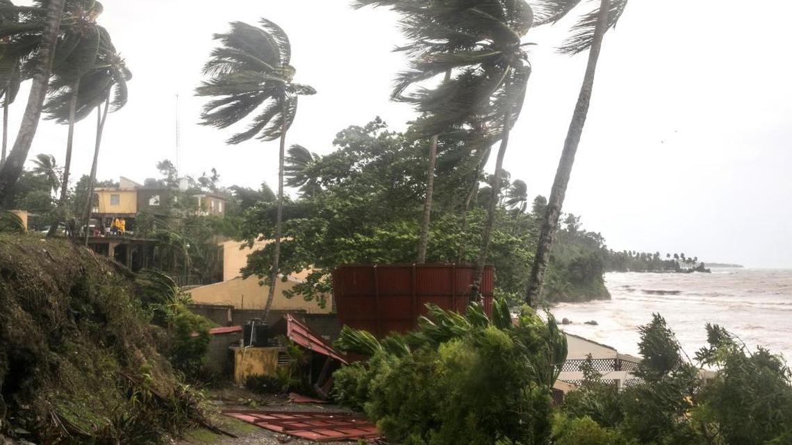 Winds brought by Hurricane Irma blow palm trees in Samana, Dominican Republic, Thursday, Sept. 7, 2017. Irma cut a path of devastation across the northern Caribbean, leaving thousands homeless after destroying buildings and uprooting trees. Irma is flooding parts of the Dominican Republic as it roars by just off the northern coast of the island it shares with Haiti.