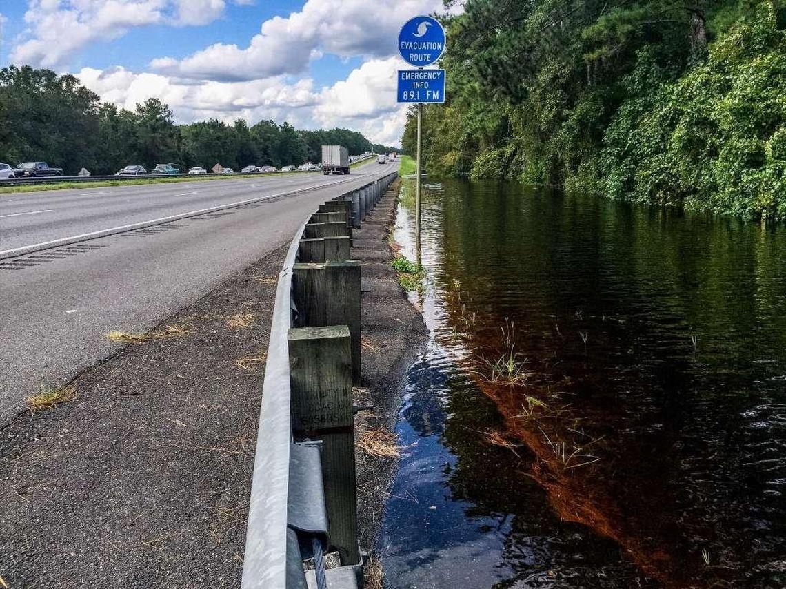 The Santa Fe River spills onto the roadway of I-75 near O’Leno State Park in High Springs, Fla., just north of the CR 236 exit Wednesday.