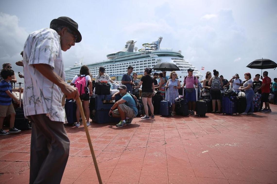 People line up to get on a Royal Caribbean International’s Adventure of the Seas, a relief boat that is sailing to Fort Lauderdale, Florida with evacuees that are fleeing after the island was hit by Hurricane Maria on Sept. 28 in San Juan, Puerto Rico. Puerto Rico experienced widespread damage including to most of the electrical, gas and water grid as well as agriculture after Hurricane Maria, a Category 4 hurricane, passed through.