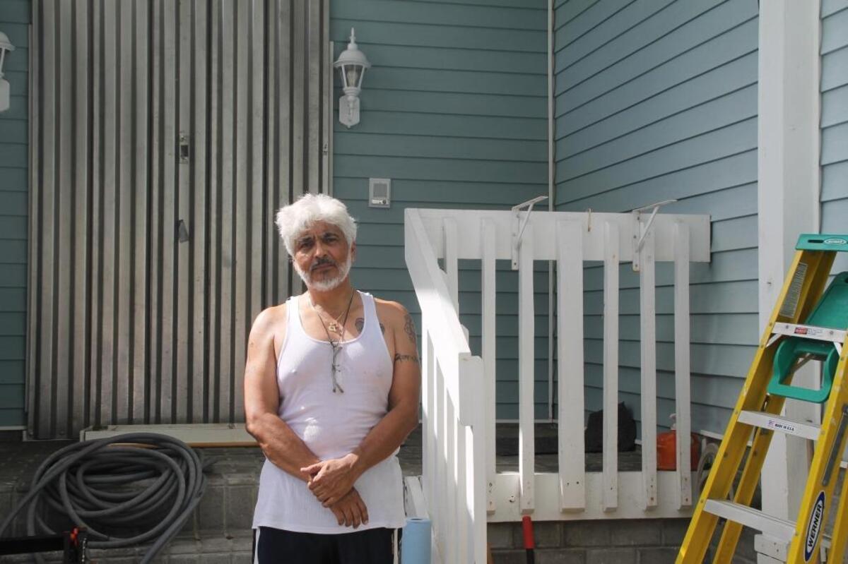 Hamira Rav Riverol stands in front of his rebuilt Country Walk home, shuttered in anticipation of Hurricane Irma, on Friday, Sept. 8, 2017. He was the only person on his block who rebuilt and stayed in Country Walk after Hurricane Andrew decimated the southwest Miami-Dade subdivision in August 1992.